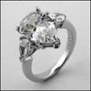 CUBIC ZIRCONIA  3 STONE RING/ 4 CT PEAR SHAPE CZ Center